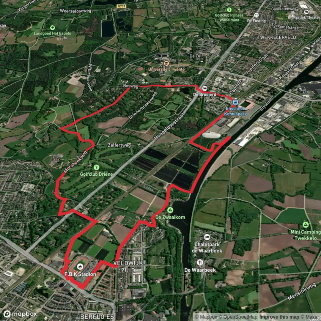 An image depicting the trail Rondje Hengelo and Rondje Enschede Loop via Retentiegebied Kristalbad and its surrounding area.
