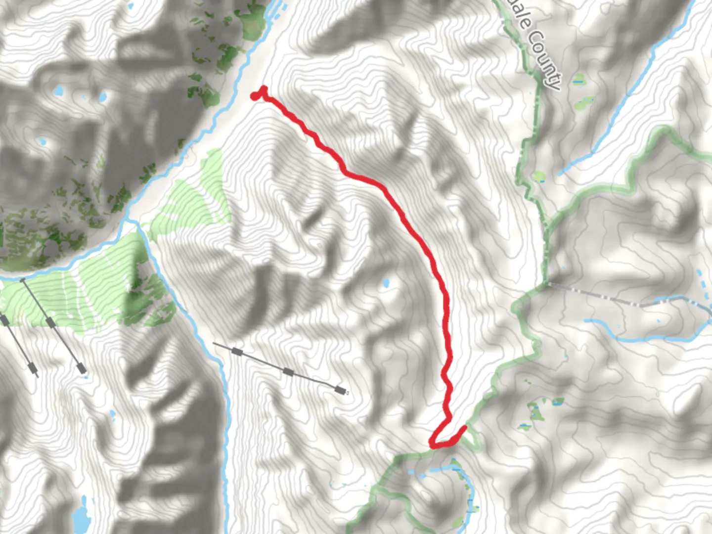 An image depicting the trail County Road 23 - Maggie Gulch Road and its surrounding area.
