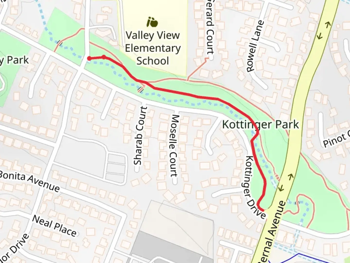 An image depicting the trail Kottinger Village Park and its surrounding area.