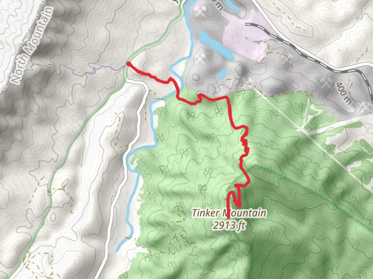An image depicting the trail Tinker Mountain via Andy Layne Trail and its surrounding area.