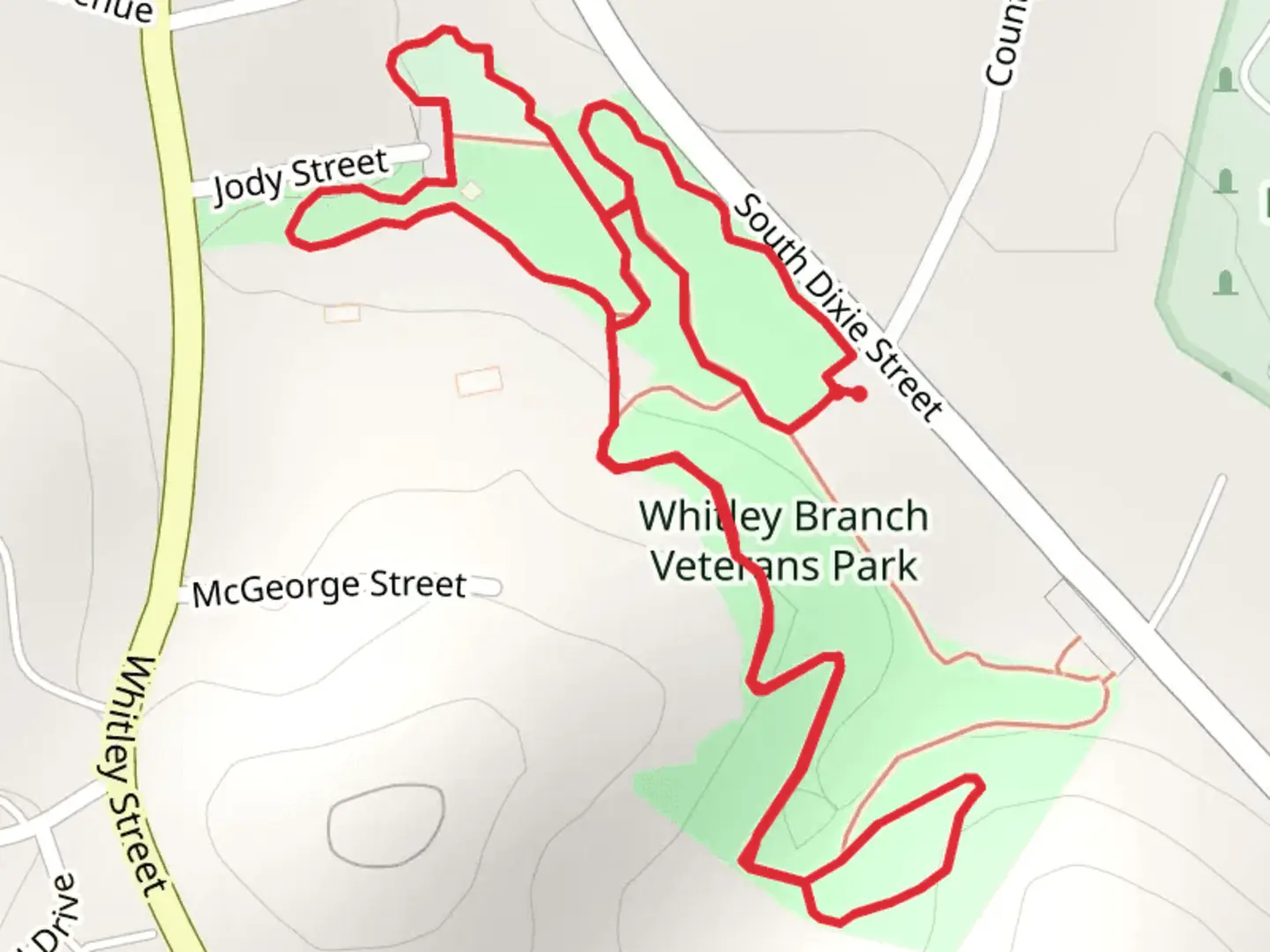 An image depicting the trail Whitley Branch Veterans Park and Whitley Branch and its surrounding area.